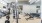 Gym at our apartments for rent in Midland, featuring free weights, bench presses, and exercise machines.